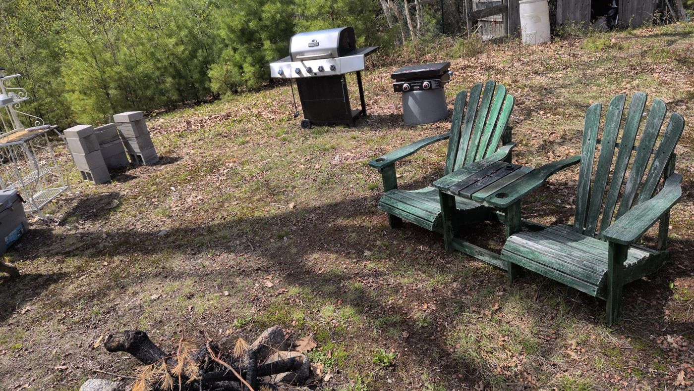 green adirondack chairs and grill at camp at Bartertowne, Canaan New Hampshire