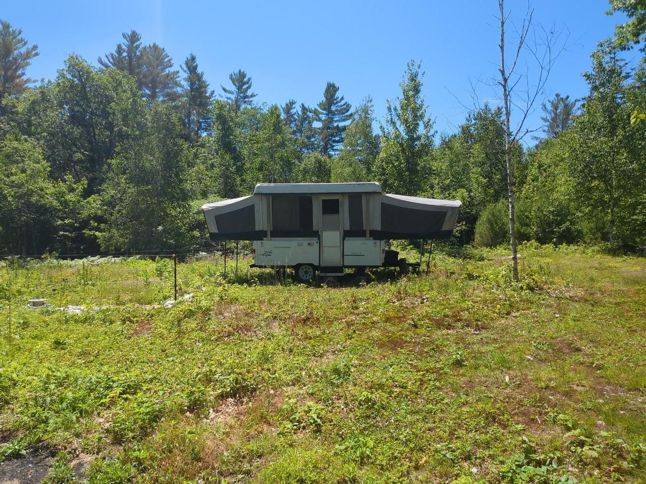 pop up camper in the summer clearing at Bartertowne, Canaan New Hampshire